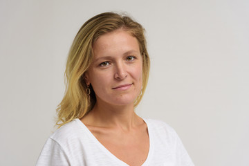 Fototapeta premium Portrait of a beautiful girl on a white background.