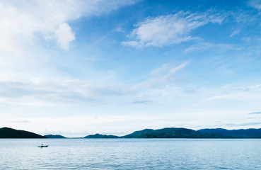 Peaceful sea evening sky and small local fishing boat of Koh Mud Sum island near Samui isalnd, Thailand