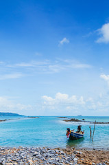 Fototapeta na wymiar Thai Longtail Fishing Boat at Koh Tean near Samui island in summer day with blue sky