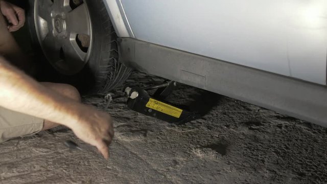 Loosening jack after replacing car wheel
