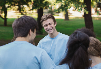Meeting of young volunteers team in park