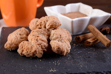 Breakfast with cinnamon biscuits and chocolate on a table 