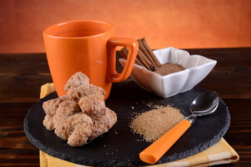 Breakfast with cinnamon biscuits and chocolate on a table 