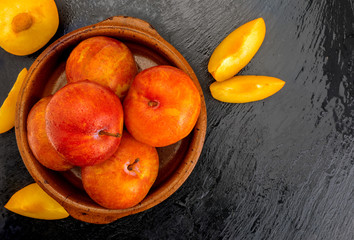 Yellow and orange plums (variety known as honey or mirabelle). Color yellow, orange, orange. Healthy diet based on fruits (detox) due to its high fiber content.