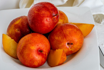 Yellow and orange plums (variety known as honey or mirabelle). Color yellow, orange, orange. Healthy diet based on fruits (detox) due to its high fiber content.