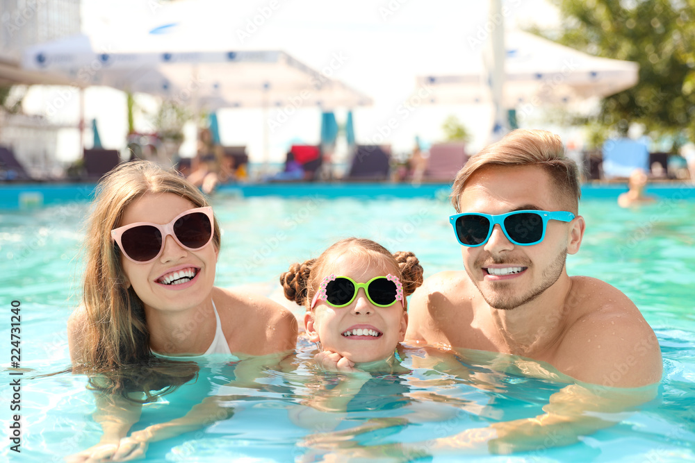 Sticker happy family in pool on sunny day