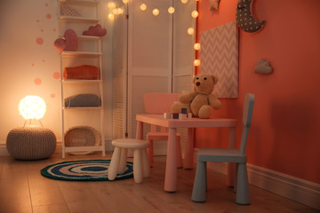 Modern child room interior with toys and decorations