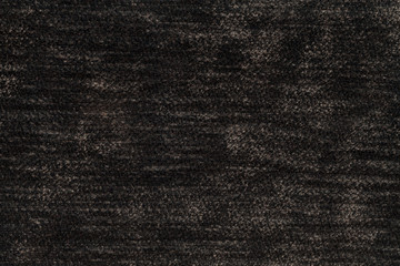 Dark brown fluffy background of soft, fleecy cloth. Texture of light nappy textile, closeup.