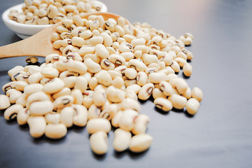 soft focus soybean in spoon and little cup on the table.