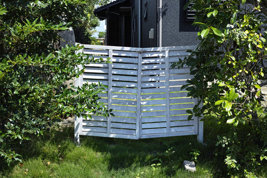 white fence entrance in a house garden