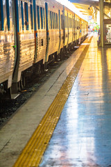 Naklejka premium Passengers are waiting for the train to place alongside of platform.