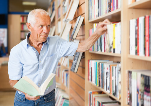 male customer visiting bookshop in search of interesting fiction