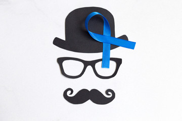 Male silhouette pattern with blue ribbon symbol. November concept.
