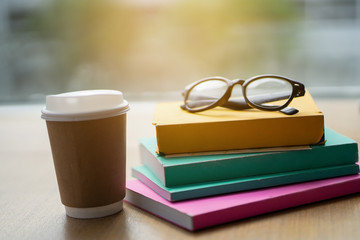 Fototapeta premium Many books are put on the table with coffee.