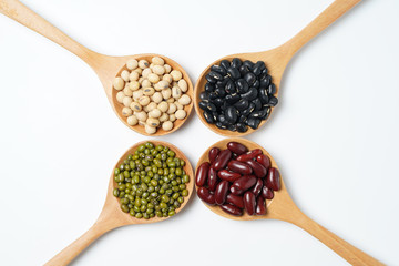 Many nuts and sesame seeds on white background.