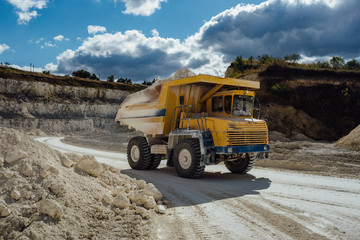 Chalk quarry. Moving dump truck loaded with chalk 