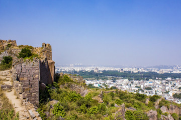 Fototapeta premium Ancient Stone Walls on the Hillside Looking out towards the Qutb Shahi Tombs at Golconda Fort in Hyderabad, India