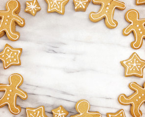 Frame of Holiday Gingerbread Cookies on a Marble Counter