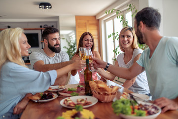 Group of friends having great time at home