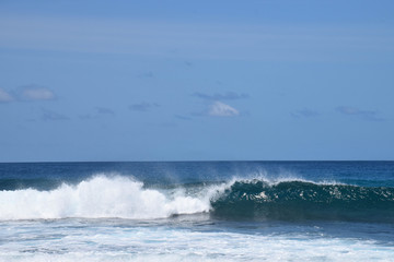 Fototapeta premium Huge waves crashing down into a frothy ocean, Pasta Point, Maldives.
