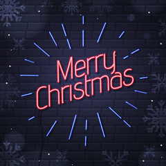 Obraz premium Neon sign merry christmas on brick wall background. Christmas greeting card design