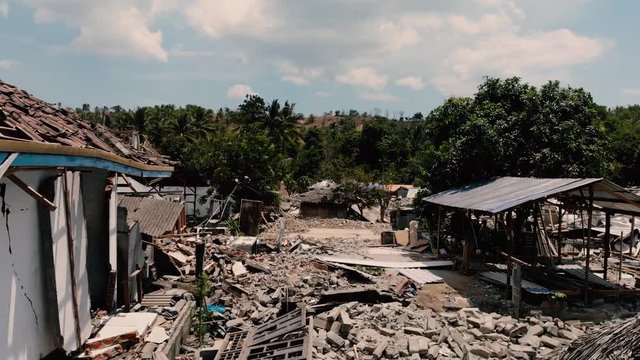 A cinematic aerial shot of the damage done by the earthquake in north Lombok, Indonesia.