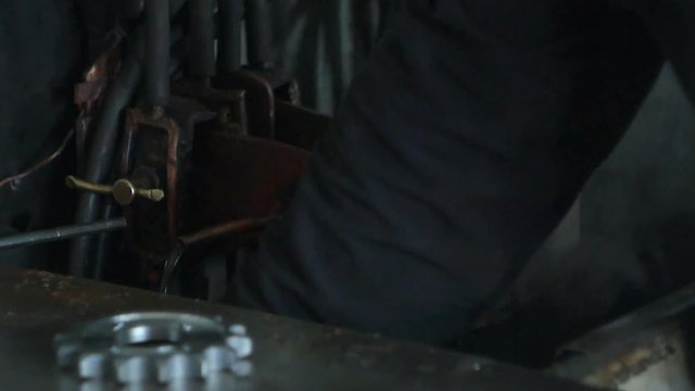Hardening and heat treatment of metal parts for mechanical engineering, close-up, heat treatment of metal parts and products on a call, close-up, industry, red-hot