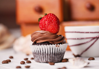 Chocolate cake with strawberries on white table