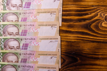 Ukrainian five hundred hryvnas banknotes on wooden table. Top view