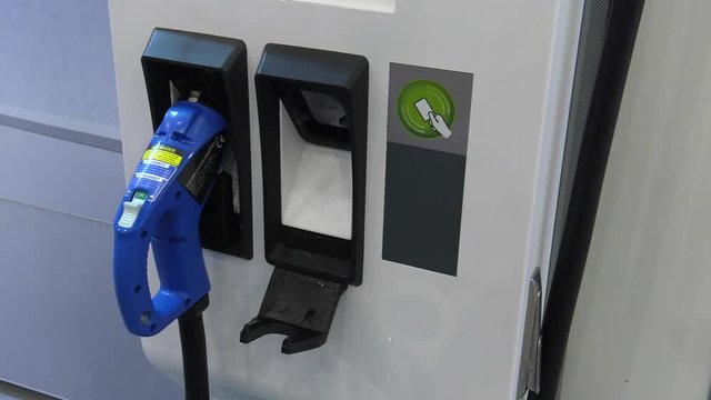 Modern electric vehicle charging station. 4K, UHD, 50p, Cinematic,Closeup, 