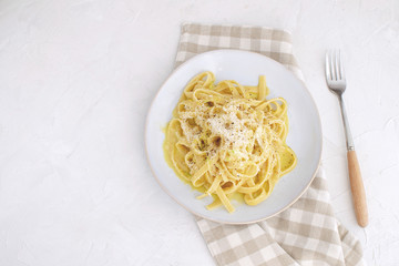 Healthy food low fat Vegetarian carbonara with zucchini Checkered napkin Slow carb dinner top view White background Copy space Horizontal