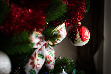 Close image of a Red Christmas Tree Decoration Ball on a branch.