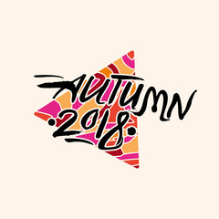 Autumn 2018. Calligraphic inscription against of a bright triangle. Art seasonal Autumn 2018 logo vector template.