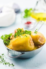 Stuffed potato with herbs and olive oil dressing. Selective focus, space for text.