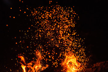 Fototapeta na wymiar Fiery fire isolated on black isolated background . Beautiful yellow, orange and red fire flame texture style.