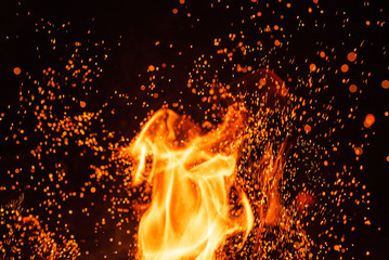 Fototapeta na wymiar Fiery fire isolated on black isolated background . Beautiful yellow, orange and red fire flame texture style.