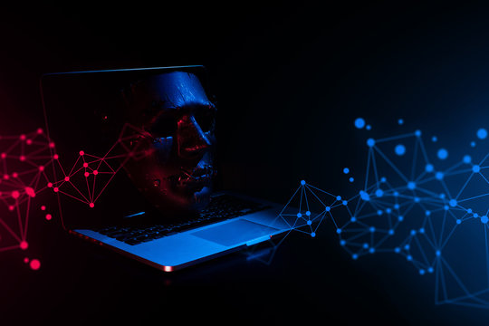 devil mask with computer notebook in hacker security network concept and hologram display red blue