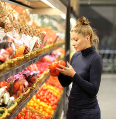 Woman buying vegetable at the market