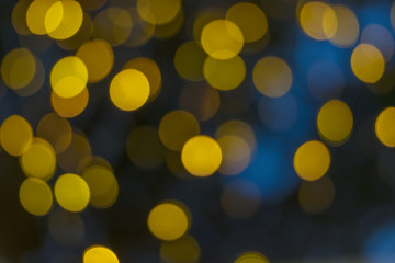 .Abstract yellow bokeh on a black background.