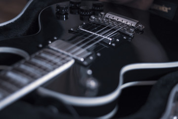 Fototapeta na wymiar Electric guitar closeup, vintage background