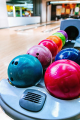 Rack Of Colorful Balls At A Bowling Alley
