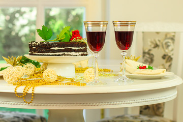 glass of red wine and a cake. Top view. food background copy space