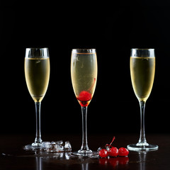 Composition with three nice high crystal cocktails glasses with transparent cold drink, melting ice...