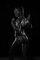 Obraz na płótnie Canvas Monochrome bodyscapes of a fit tattooed woman