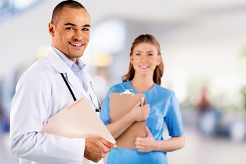 Fototapeta premium Male doctor with female nurse in the