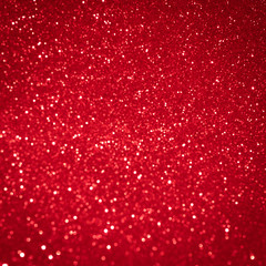 Red background light christmas holiday pattern. Abstract decoration bokeh gllitter xmas and new year or valentine festive.