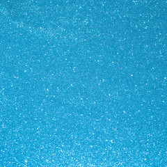 Blue background for christmas navy glitter sparkle. Abstract bokeh light shiny dark holiday.