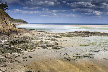 Amazing sunset in low tide on the wild rocky seashore in St Brieuc Brittany, France