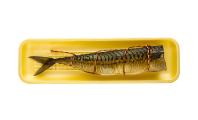 Smoked mackerel on a white background. Mackerel hot smoked in a container from a shop isolated on white background.