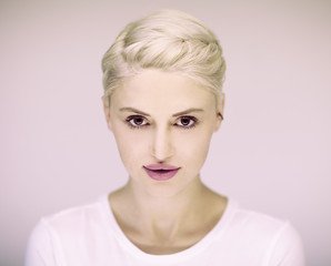 Naklejka premium beautiful blonde german woman with perfect make up and braided hair, pink rosy lips and background